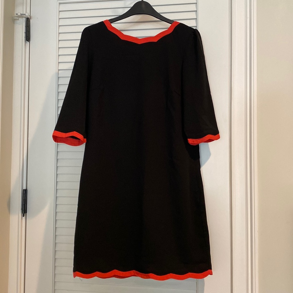 Bought at an independent UK boutique. Eye-catching dress with unique back style.